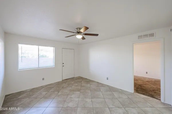 a view of an empty room with a window