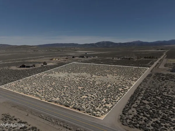 a view of a floor to ceiling window and a yard