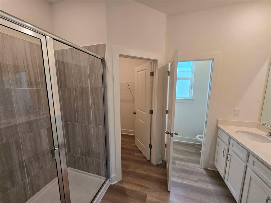 3836 Daybreak Run Loop Spring Hill, FL 34609 - Photo 8 of 13 a bathroom with a sink and a shower