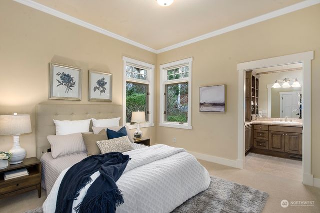 a bedroom with a bed and a couch