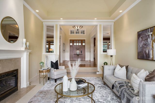 a living room with furniture and a fireplace