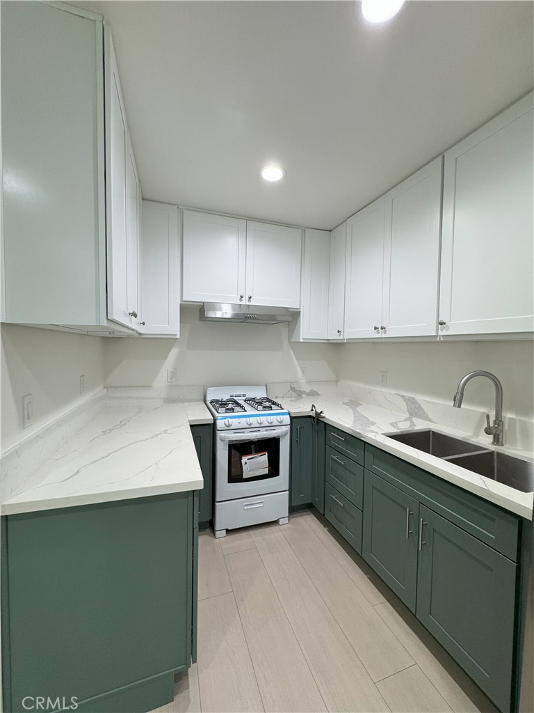 8520 Fenwick Street Sunland, CA 91040 - Photo 14 of 15 a kitchen with a sink and cabinets