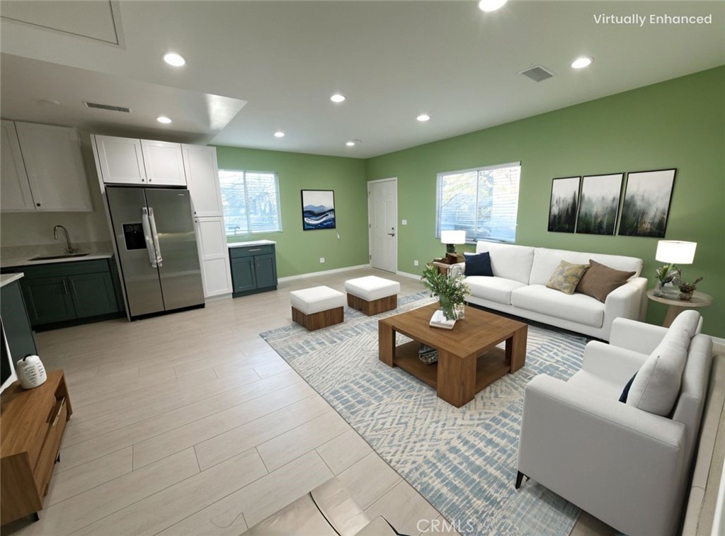 8520 Fenwick Street Sunland, CA 91040 - Photo 2 of 15 a living room with furniture and kitchen view