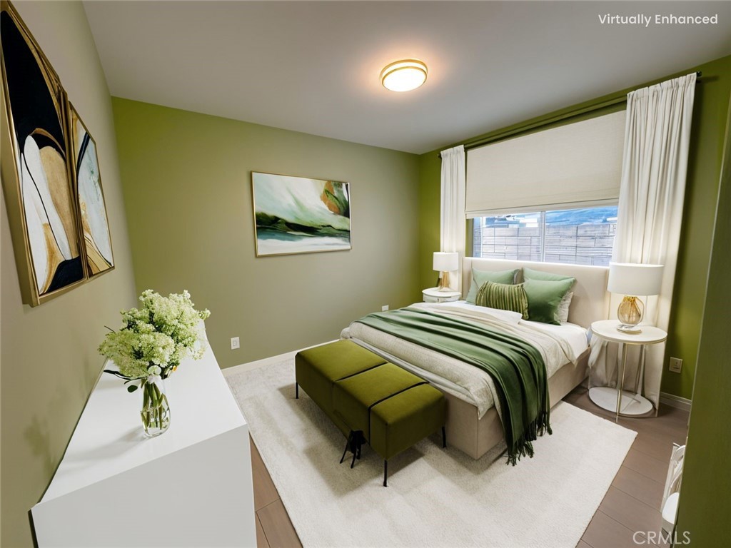 8520 Fenwick Street Sunland, CA 91040 - Photo 5 of 15 a bedroom with a bed and a couch