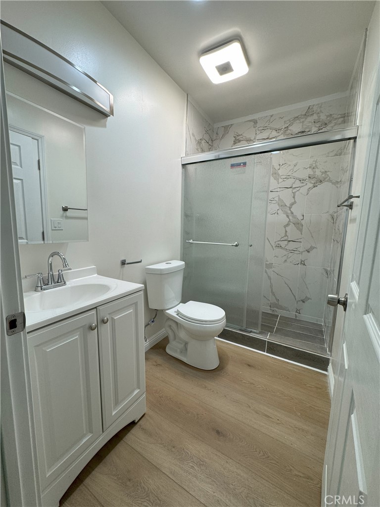 8520 Fenwick Street Sunland, CA 91040 - Photo 7 of 15 a bathroom with a double vanity sink toilet and shower