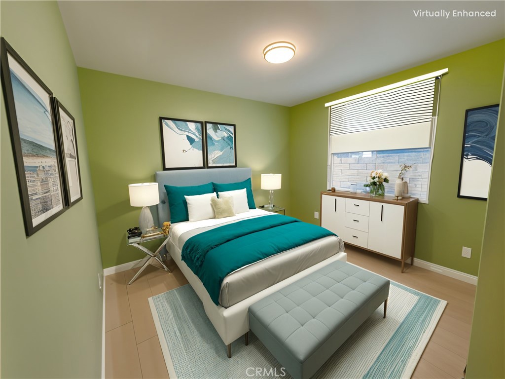 8520 Fenwick Street Sunland, CA 91040 - Photo 9 of 15 a bedroom with a bed and window