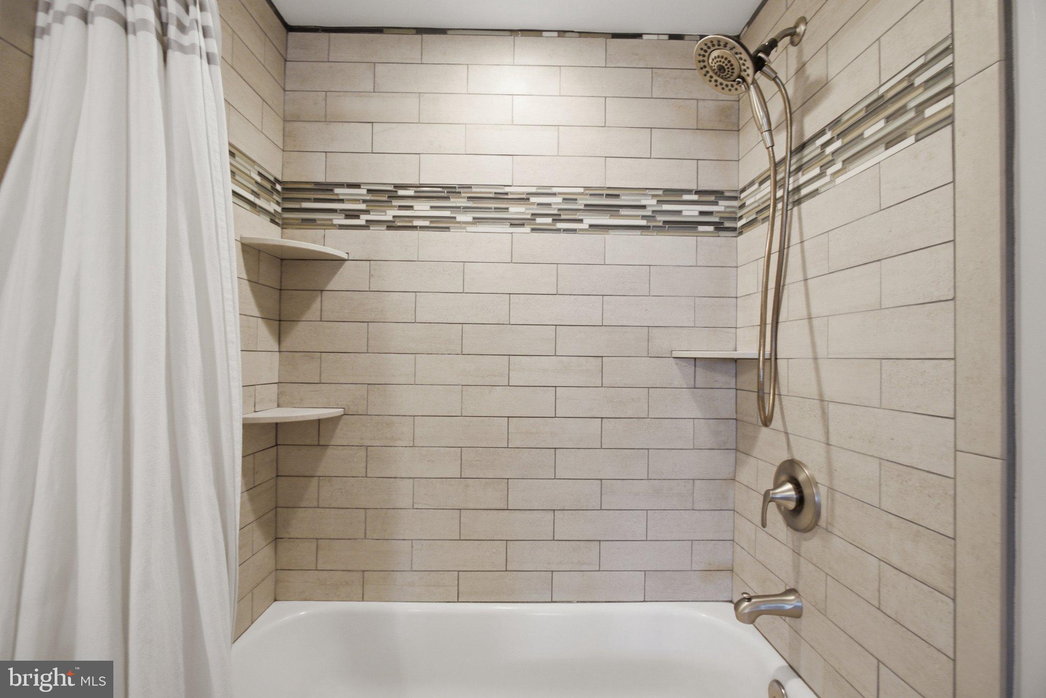 5650 Deale Churchton Road Churchton, MD 20733 - Photo 31 of 31 Modern shower with elegant tile design.
