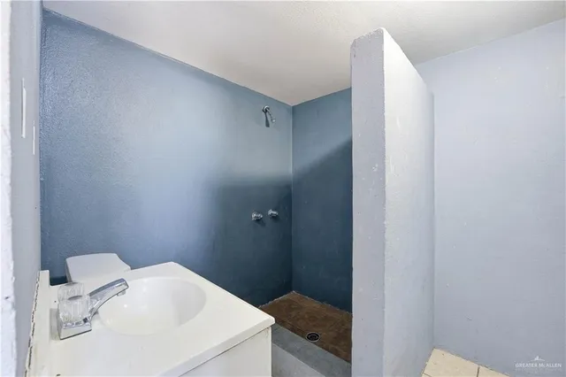 a bathroom with a sink and mirror