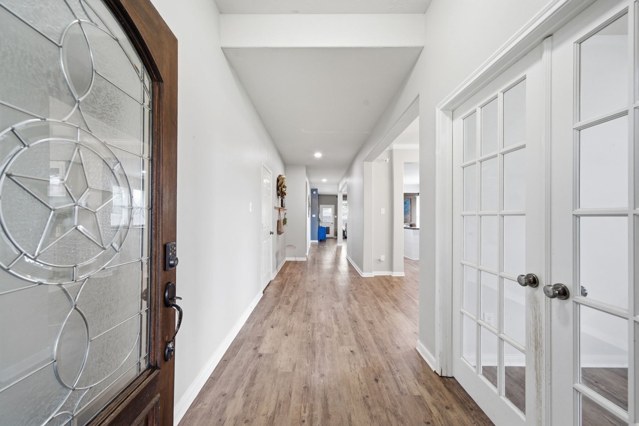 8911 Henrico Lane Rosenberg, TX 77469 - Photo 45 of 45 a view of a hallway with wooden floor and staircase