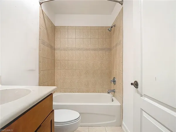 a bathroom with a sink a toilet and bathtub