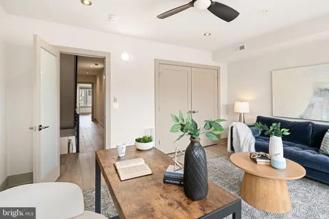 a bedroom with bed and wooden floor
