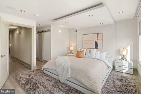 a bathroom with a shower sink and mirror