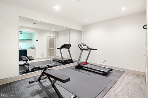 a kitchen with a sink a stove and cabinets