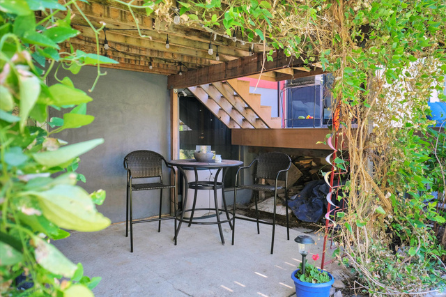 510 Spring Creek Road Providence, UT 84332 - Photo 55 of 97 Outdoor patio area with a concrete slab, overhead wood pergola, and string lighting