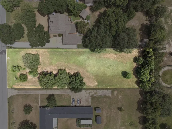 an aerial view of a residential houses with outdoor space