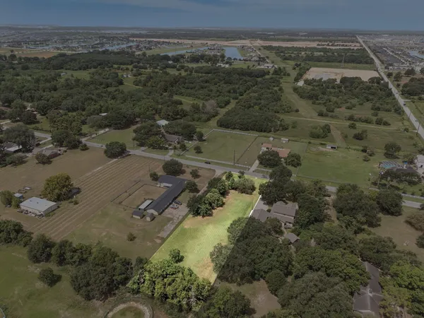 an aerial view of residential house with outdoor space