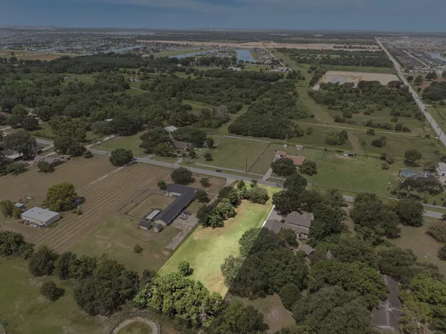 an aerial view of residential house with outdoor space