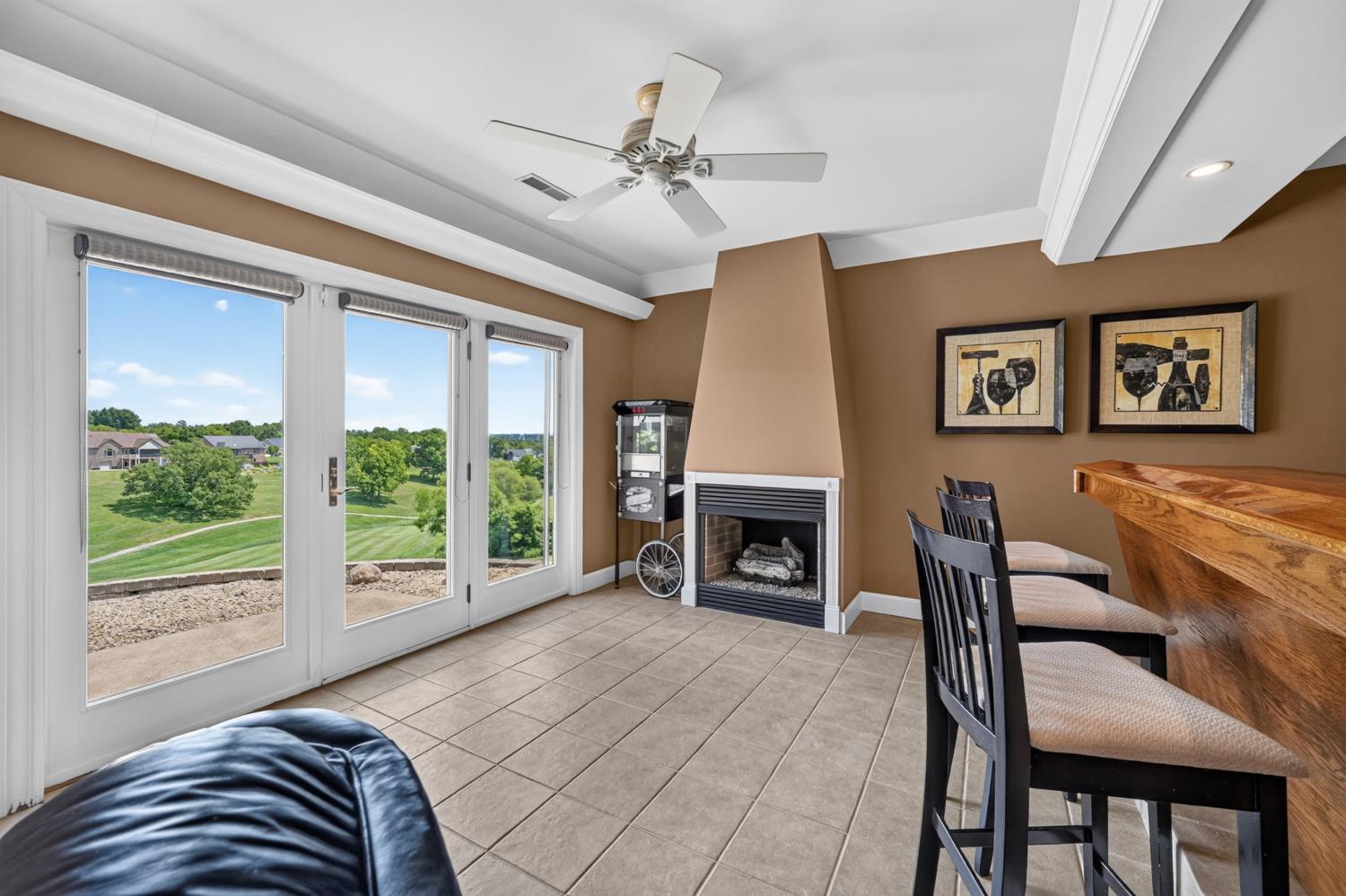 20980 State Line Road Lawrenceburg, IN 47025 - Photo 58 of 99 Triple doors to the rear patio near the bar & fireplace
