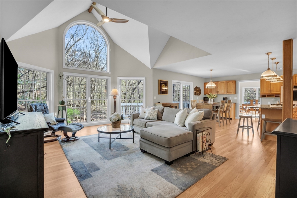 133 Nashaway Road Bolton, MA 01740 - Photo 12 of 42 a living room with furniture large window and a table