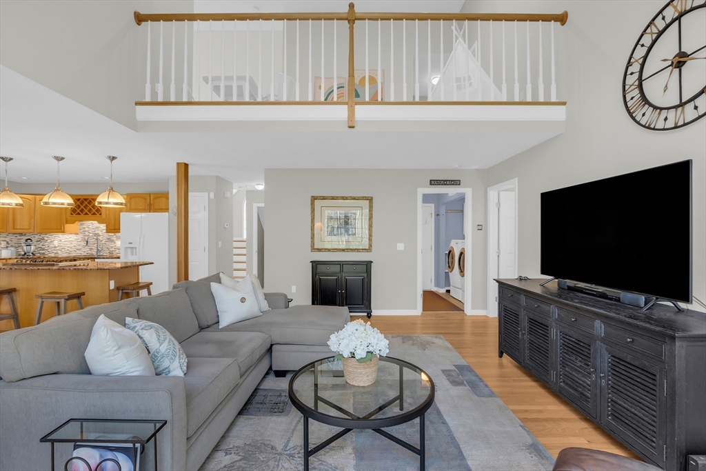 133 Nashaway Road Bolton, MA 01740 - Photo 14 of 42 a living room with furniture and a flat screen tv