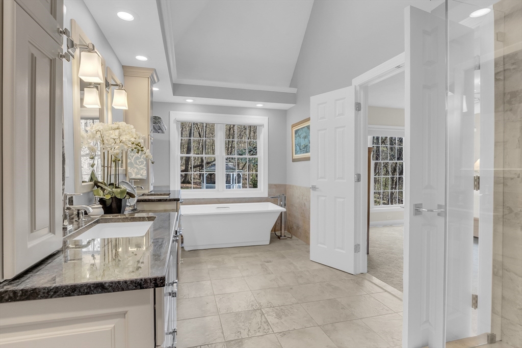 133 Nashaway Road Bolton, MA 01740 - Photo 18 of 42 a bathroom with a granite countertop tub shower and sink