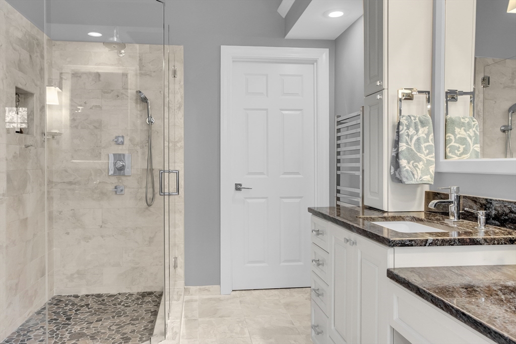 133 Nashaway Road Bolton, MA 01740 - Photo 19 of 42 a bathroom with a granite countertop sink a shower and a mirror