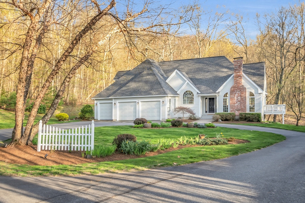 133 Nashaway Road Bolton, MA 01740 - Photo 2 of 42 a front view of a house with a garden