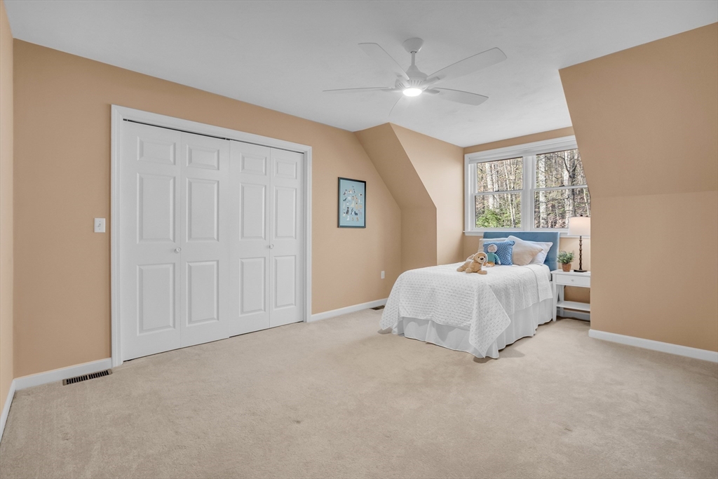 133 Nashaway Road Bolton, MA 01740 - Photo 27 of 42 a bed room with a bed and a window