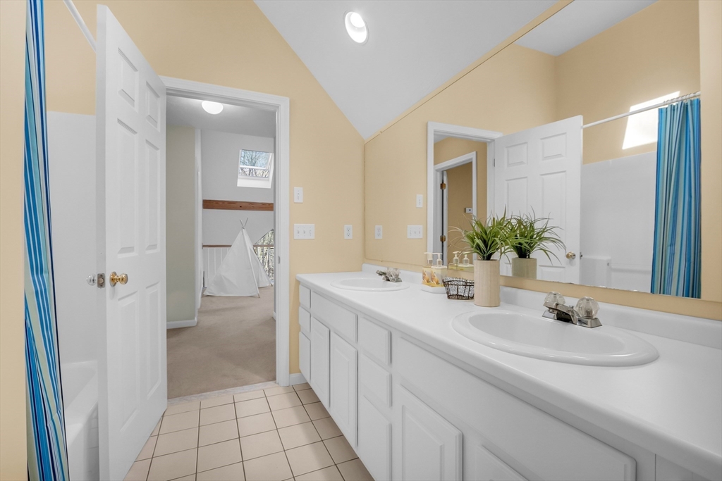 133 Nashaway Road Bolton, MA 01740 - Photo 28 of 42 a bathroom with a sink and a mirror