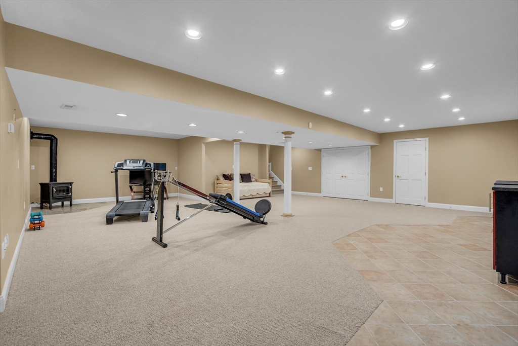 133 Nashaway Road Bolton, MA 01740 - Photo 30 of 42 a view of a room with gym equipment and windows