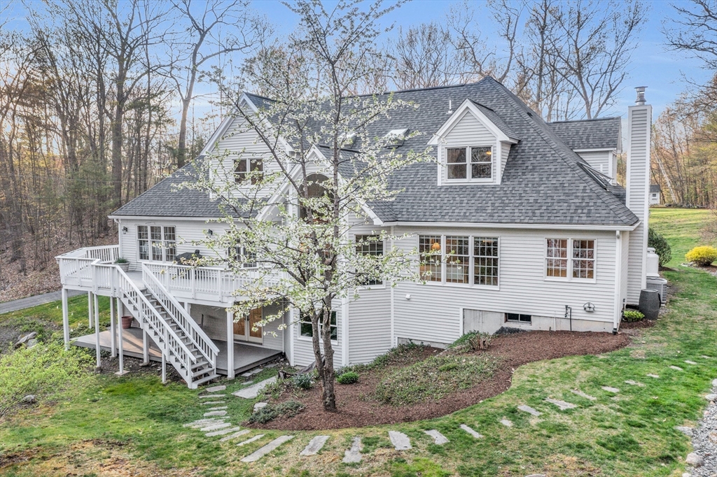 133 Nashaway Road Bolton, MA 01740 - Photo 36 of 42 a front view of a house with a yard