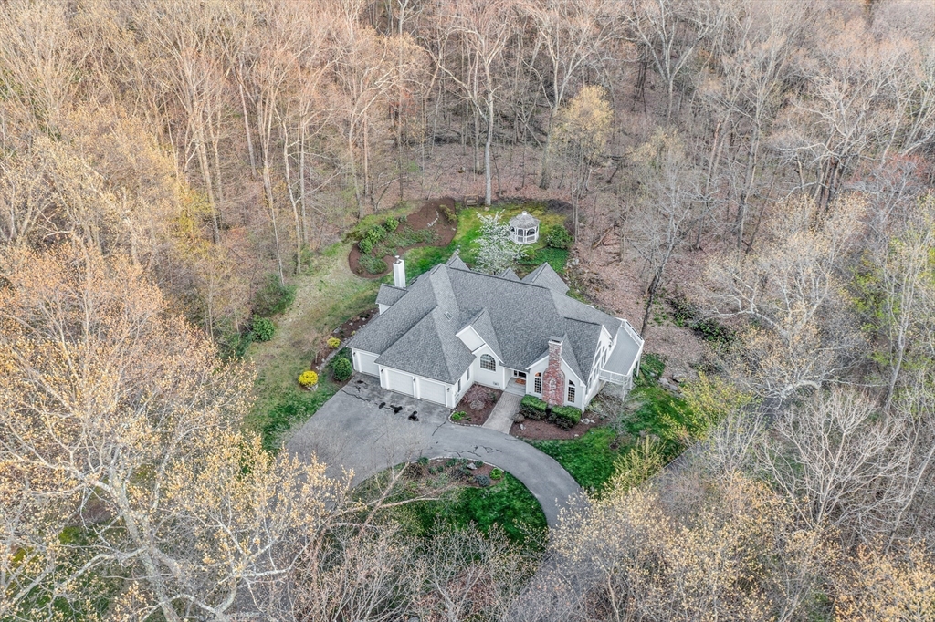 133 Nashaway Road Bolton, MA 01740 - Photo 40 of 42 a view of a garden with a pathway