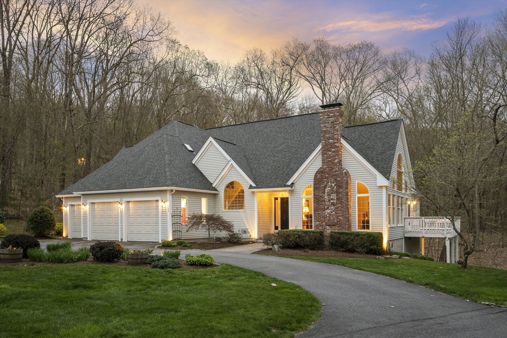133 Nashaway Road Bolton, MA 01740 - Photo 41 of 42 a front view of a house with a yard