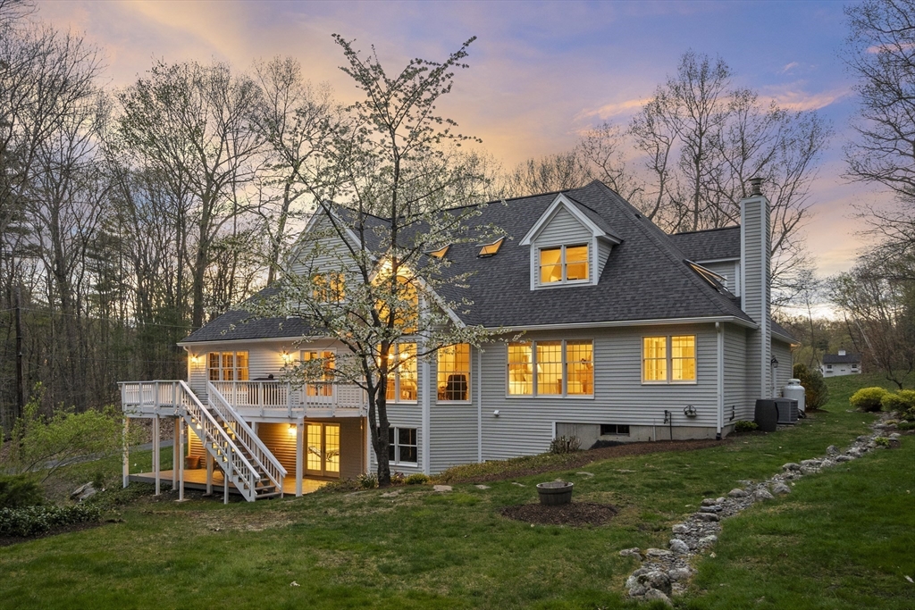 133 Nashaway Road Bolton, MA 01740 - Photo 42 of 42 a front view of house with an outdoor space and seating