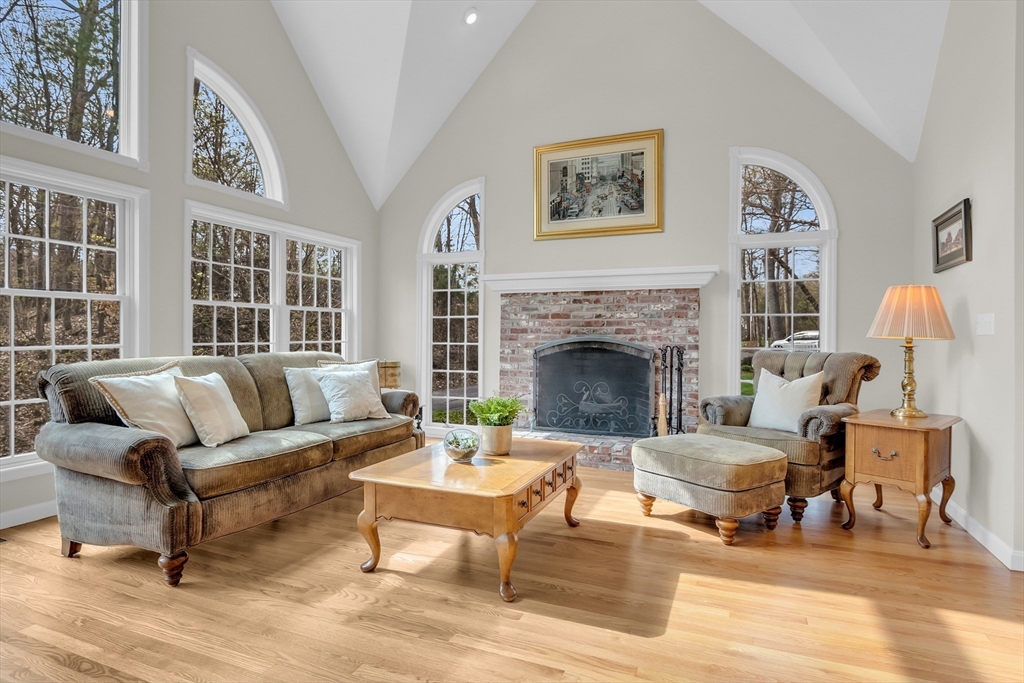 133 Nashaway Road Bolton, MA 01740 - Photo 5 of 42 a living room with furniture lamp and a fireplace