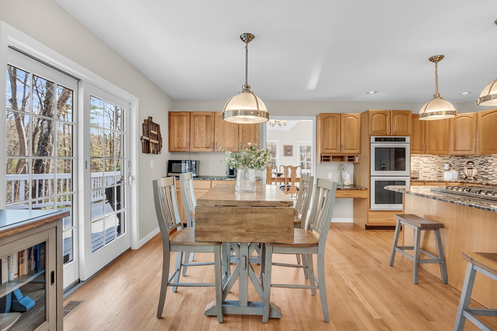 133 Nashaway Road Bolton, MA 01740 - Photo 10 of 42 a view of a dining room with furniture window and wooden floor
