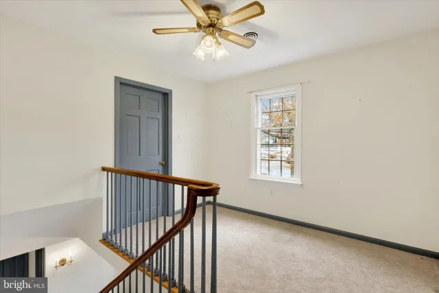 a spacious bedroom with a bed and a couch