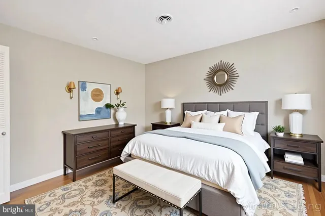 a bathroom with a toilet a sink and a mirror