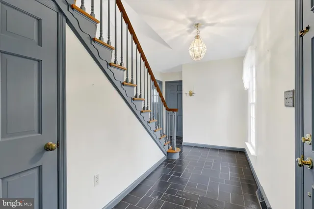 a view of an empty room with windows