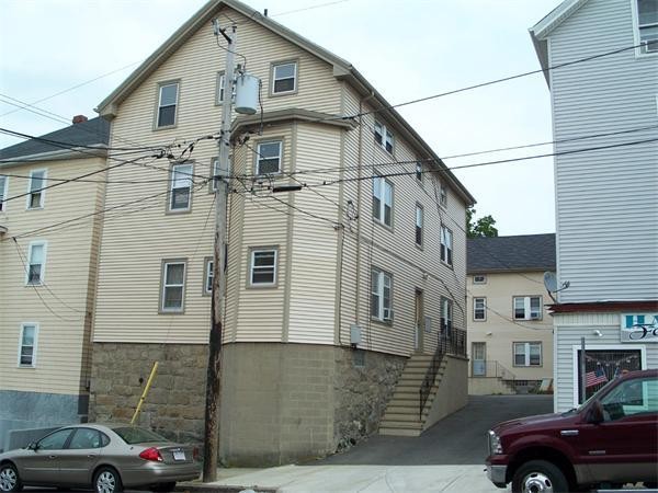 302-304 Broadway Fall River, MA 02721 - Photo 1 of 1 a front view of a house with parking space