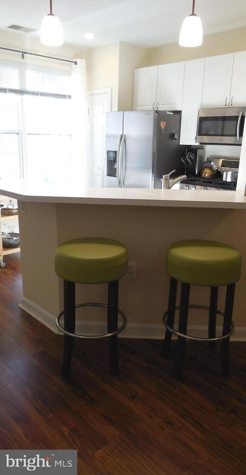4320 Cannon Ridge Court, Unit 63 Fairfax, VA 22033 - Photo 11 of 73 Bright open kitchen with breakfast bar.