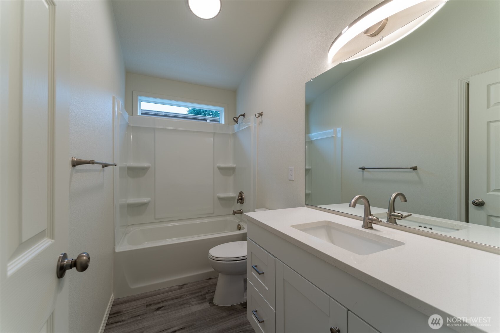 569 North 3rd Kalama, WA 98625 - Photo 13 of 22 a bathroom with a sink a toilet and shower