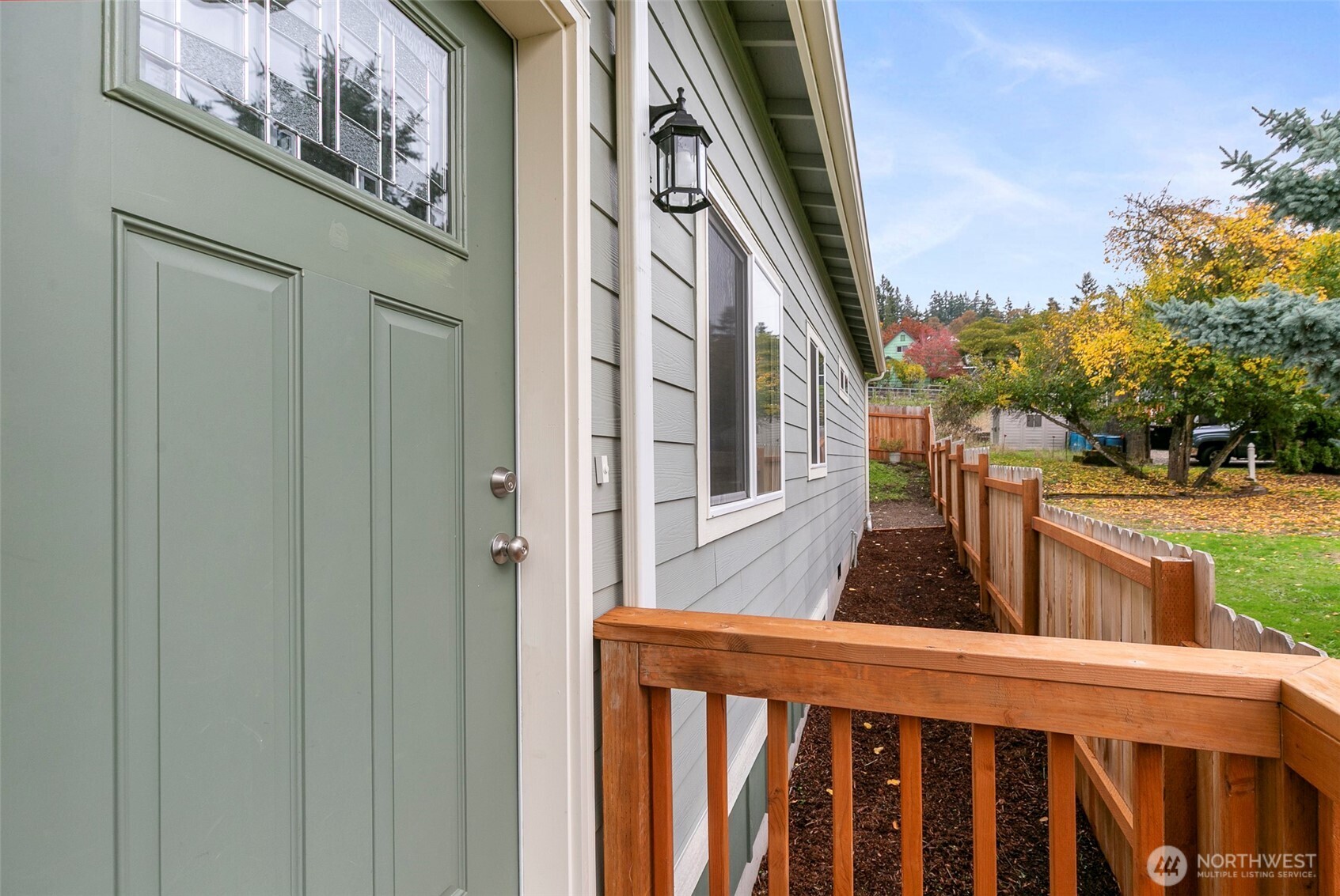 569 North 3rd Kalama, WA 98625 - Photo 6 of 22 a couple of potted plants in front of a door