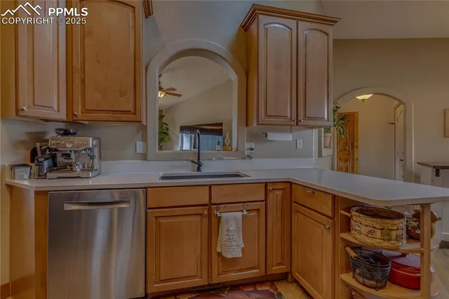 a kitchen with a sink and cabinets