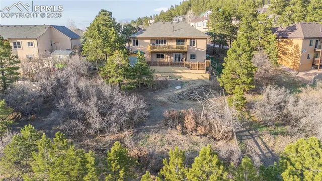a front view of a house with a yard and fountain