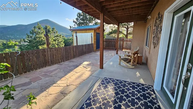 a view of a two chairs in the balcony