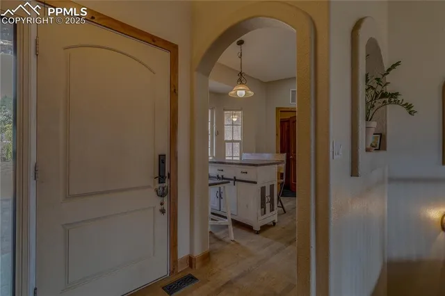 a view of hall way with mirror