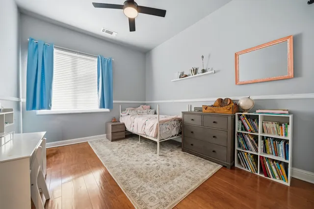 a bedroom with a bed and a book shelf