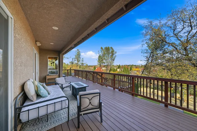 a view of balcony with furniture