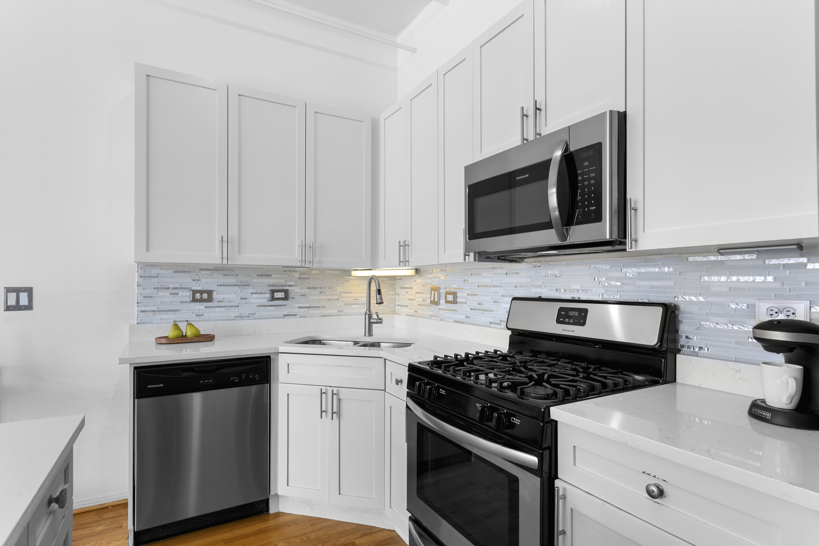 950 West Monroe Street, Unit 616 Chicago, IL 60607 - Photo 11 of 28 a kitchen with stainless steel appliances granite countertop white cabinets a stove a sink and dishwasher